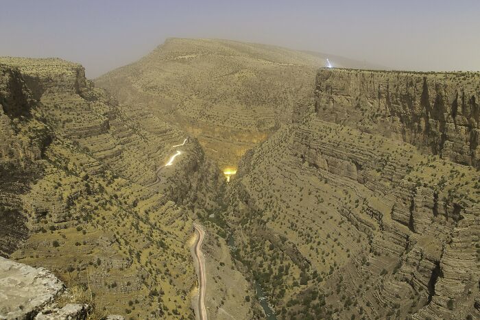 Deep canyon with winding roads seen from a high stunning viewpoint