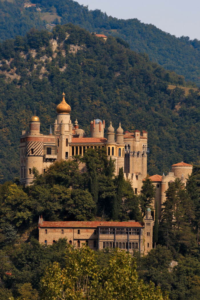 Historic castle surrounded by lush green forests with captivating stunning views