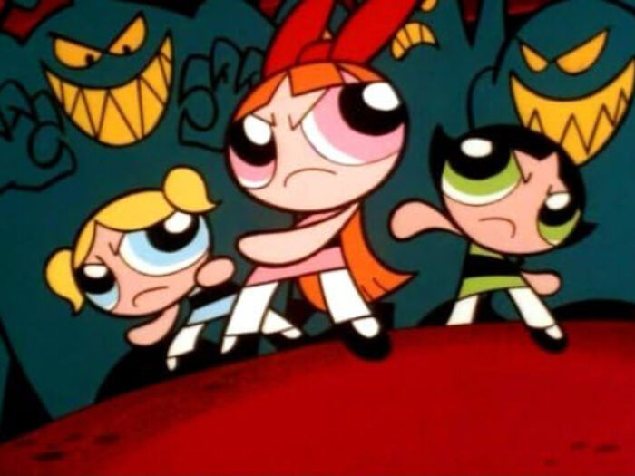 Cartoon of Powerpuff Girls superhero characters standing ready to fight