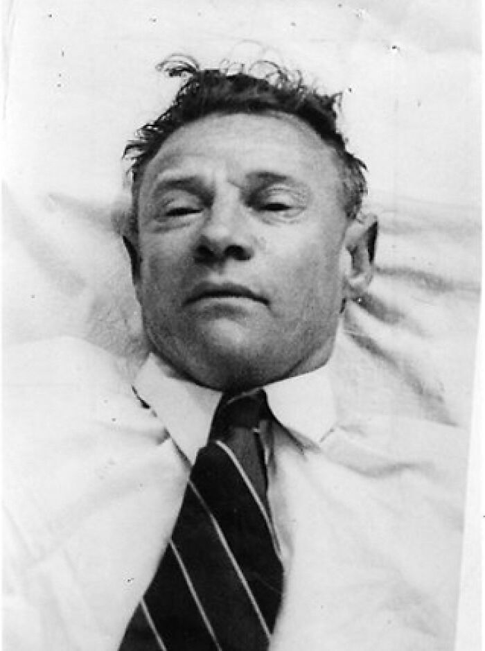 Vintage black and white mysterious man portrait with unusual expression