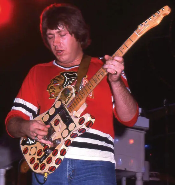 Guitarist performing on stage highlighting career fail moments