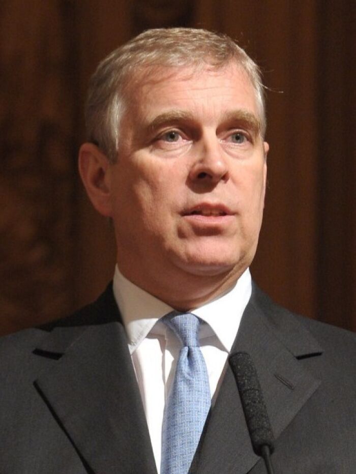 Close-up of a man in a suit and tie speaking at a career ruined event