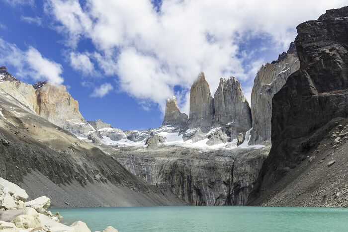 Jagged mountain peaks above turquoise lake stunning mountain lake views