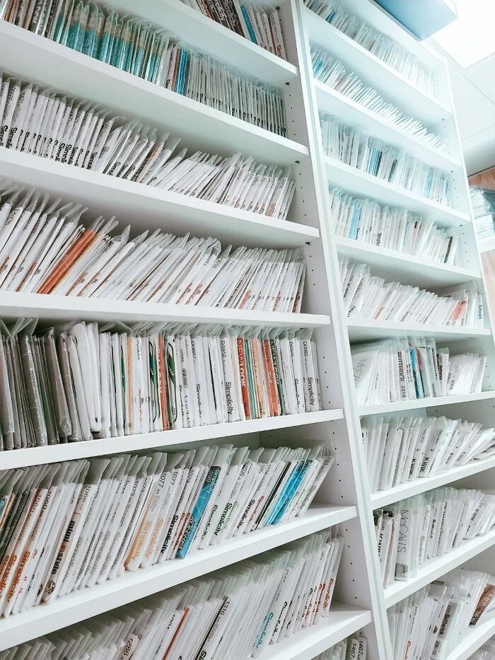 Shelves filled with organized files and documents in a workspace