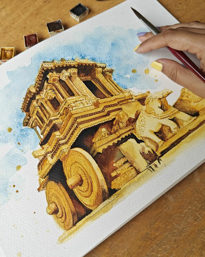 Hand painting a detailed watercolor of an ancient carved wooden chariot