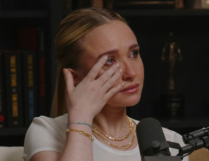 Hayden Panettiere wiping tears during a podcast interview