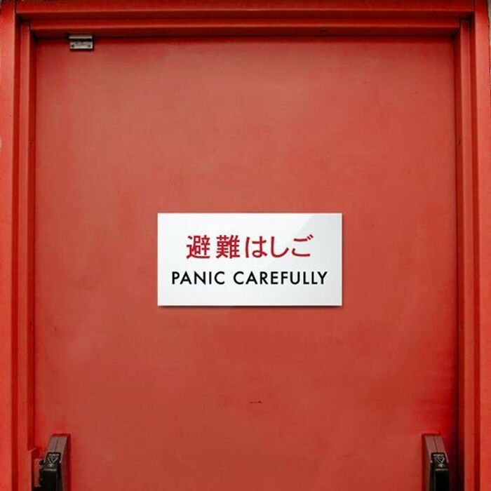 Funny red door sign with mistranslated panic carefully warning