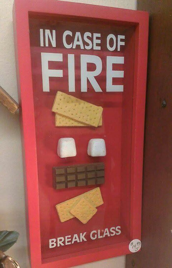 Funny fire sign with chocolate, crackers, and marshmallows inside a red box