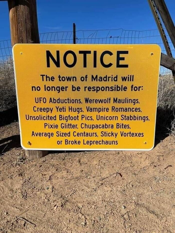 Humorous notice sign listing absurd creatures town of Madrid not responsible for