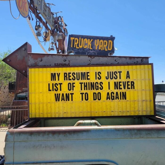 Funny sign at truck yard about resume listing unwanted jobs