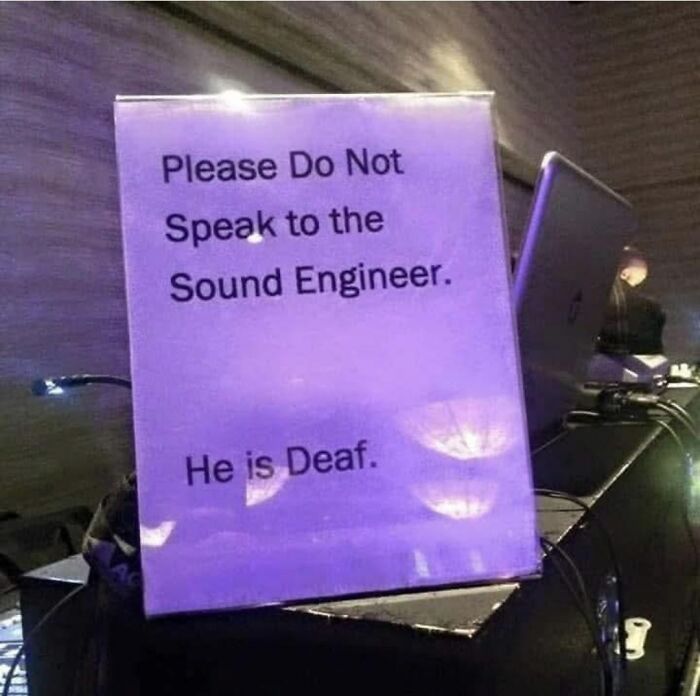 Hilariously absurd sign warns not to speak to sound engineer because he is deaf