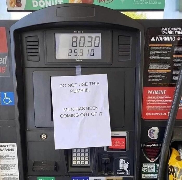 Funny gas pump sign warning milk is coming out