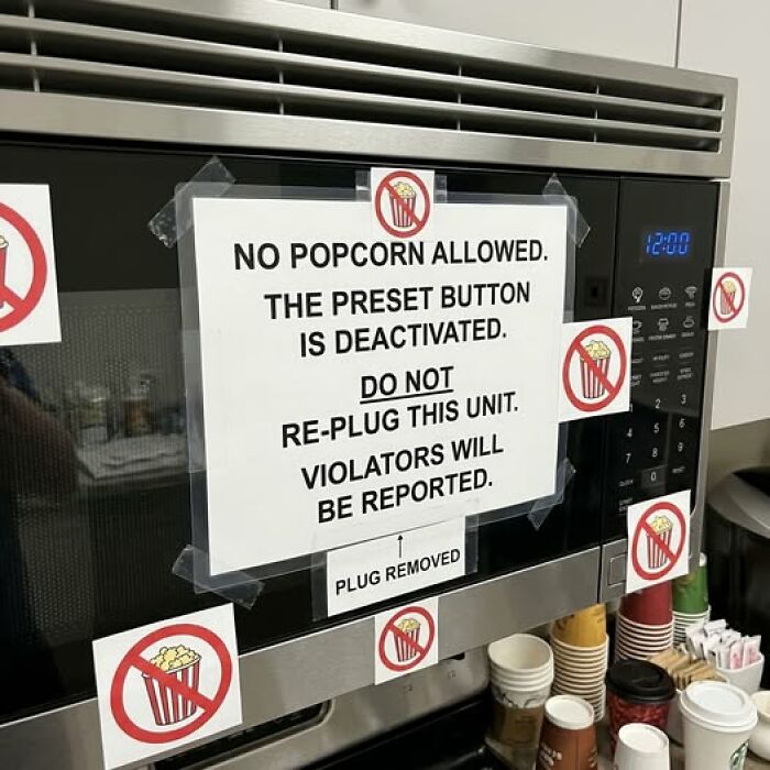 Microwave sign bans popcorn with preset button deactivated warning