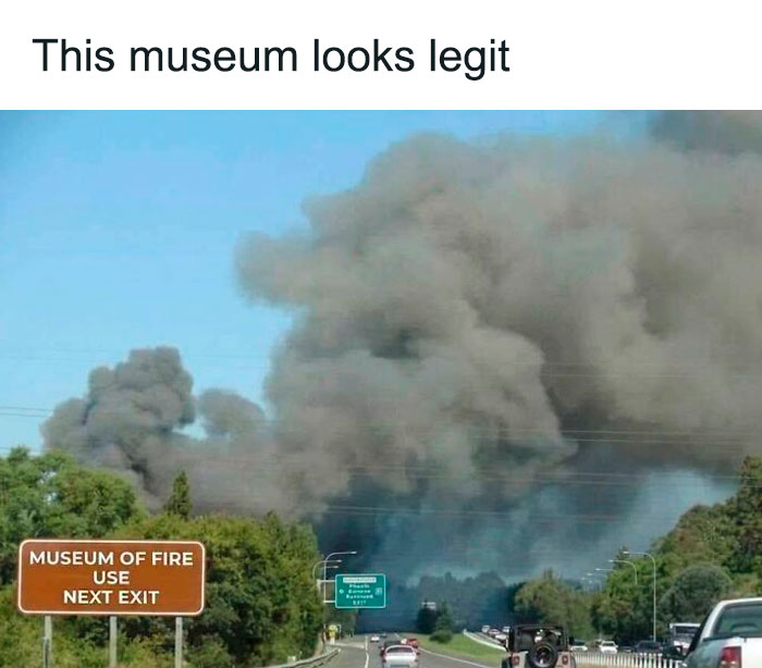 Funny road sign for museum of fire with large smoke cloud