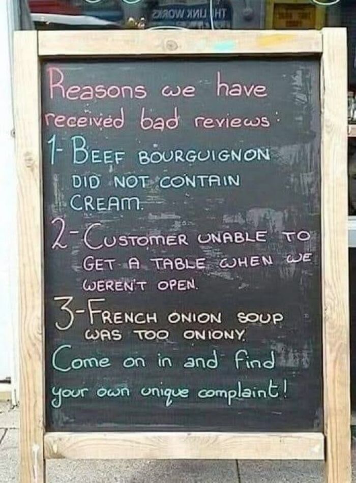 Funny blackboard listing absurd reasons for bad restaurant reviews