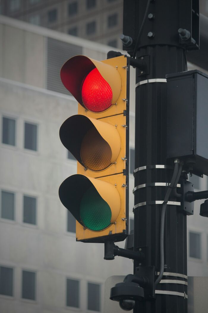 A traffic light with red and green lights on, symbolizing a difficult decision, like a challenging legal case for lawyers.