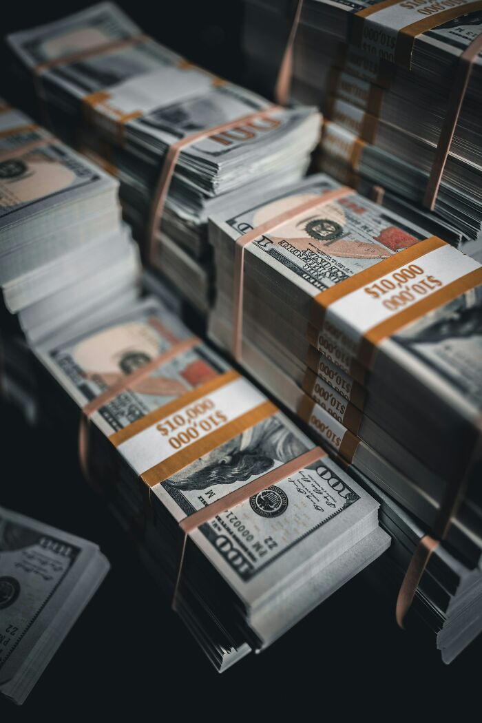 Stacks of hundred dollar bills bundled representing money and finance