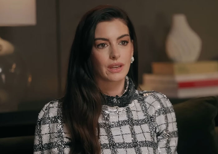 Anne Hathaway discussing her serious diagnosis and health battle in an interview setting