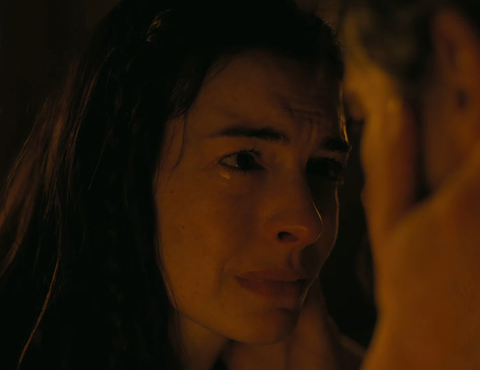 Anne Hathaway emotional close-up scene in dim light