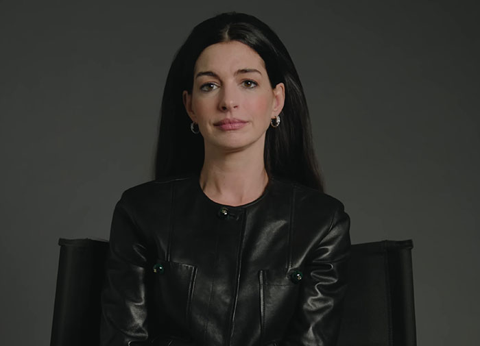 Anne Hathaway in black leather jacket revealing health battle