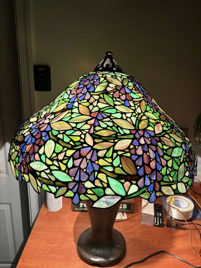Colorful vintage stained glass lamp shade featuring floral design