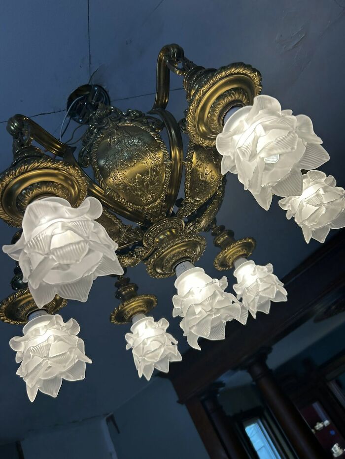 Ornate vintage secondhand chandelier with floral-shaped glass shades