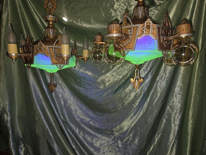 Vintage secondhand chandelier with glowing green glass accents and bulbs