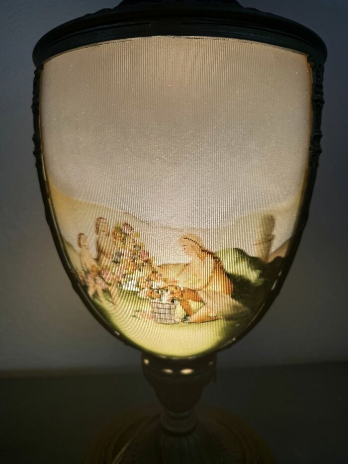 Vintage secondhand lamp with painted scene on illuminated shade