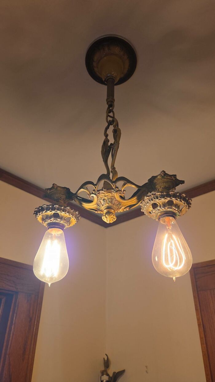 Antique ceiling lamp with double Edison bulbs and intricate metalwork