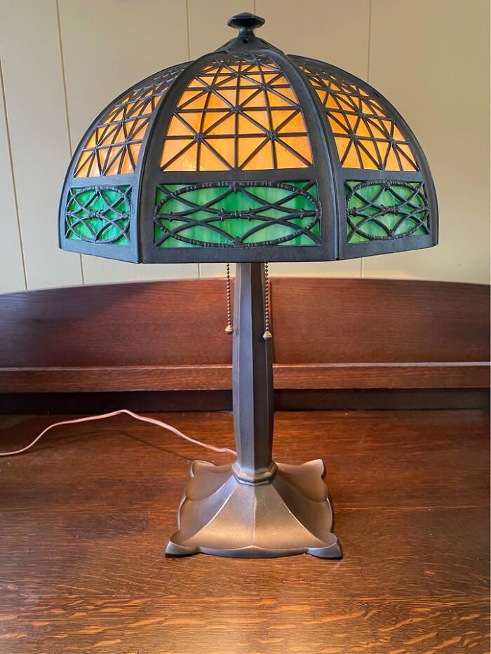 Tiffany style stained glass vintage lamp with geometric green and amber pattern
