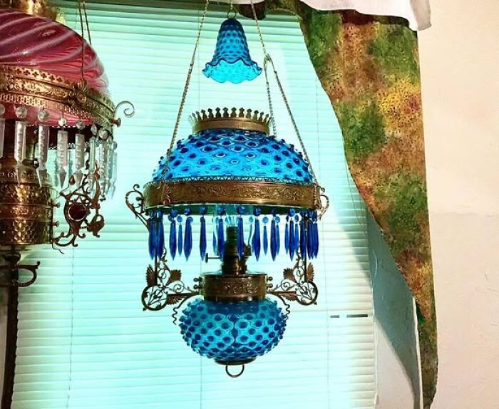 Blue vintage secondhand hanging lamp with ornate brass and glass design