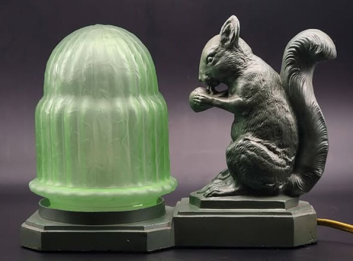 Vintage secondhand lamp with green glass shade and squirrel figure base