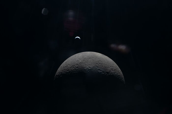 Crescent Earth Over Lunar Horizon