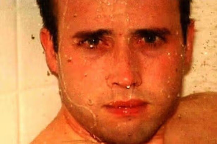 Close up creepy photo of man with water running down face
