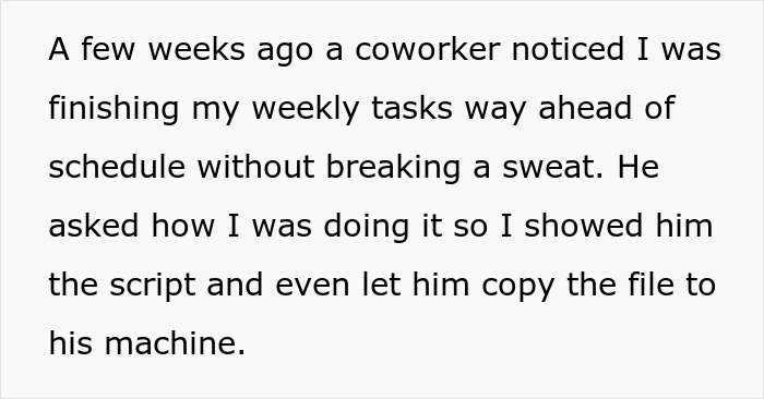 Two smiling coworkers reviewing work on a laptop together