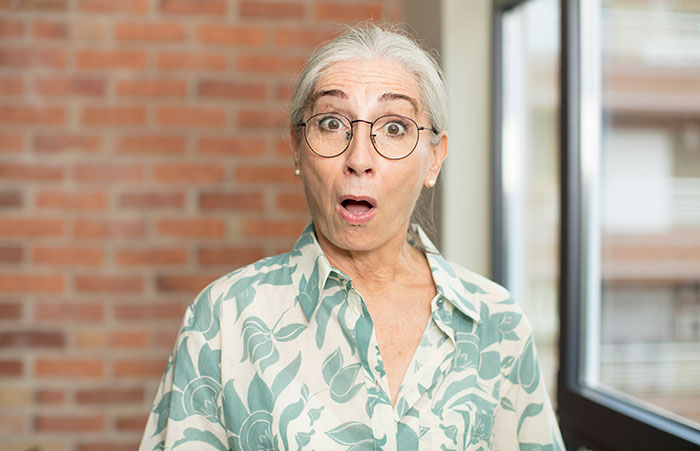 Shocked older woman with glasses reacts in wedding mil video scene Shocked older woman with glasses reacts in wedding mil video scene
