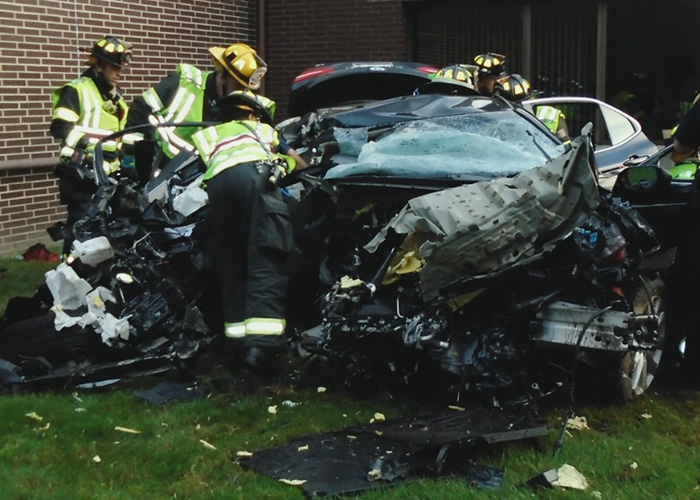 Firefighters inspecting severe crash wreckage after Mackenzie Shirilla accident