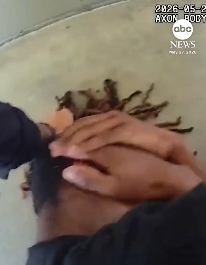 Close-up of female cop pinning high school boy during viral arrest footage Close-up of female cop pinning high school boy during viral arrest footage