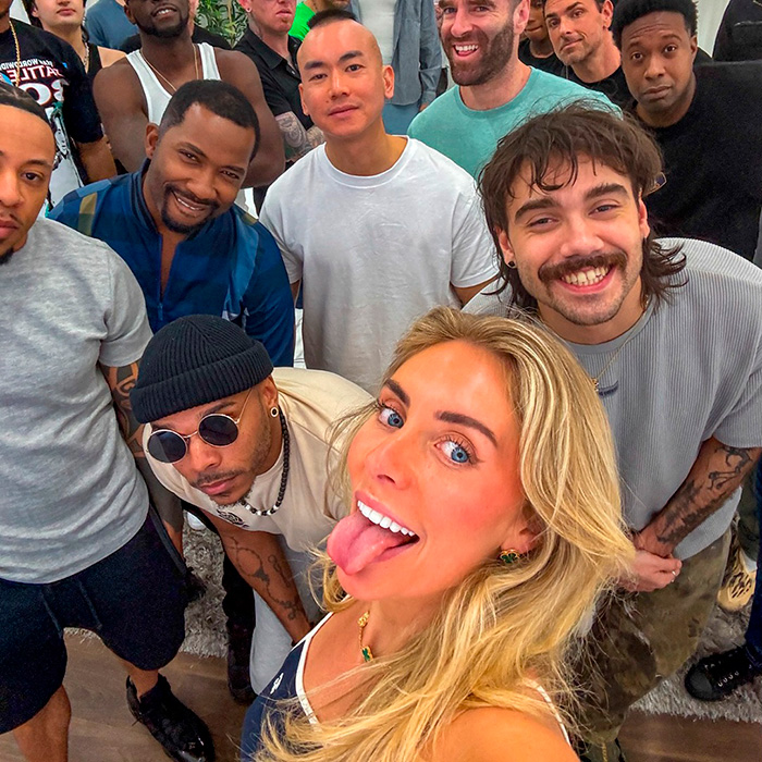 Bonnie Blue smiling with a group of diverse friends at a social event
