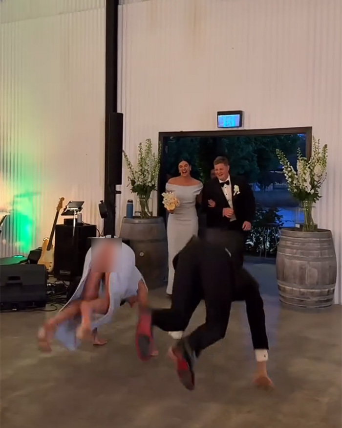 Wedding guests laughing after bridesmaid’s wardrobe malfunction dance