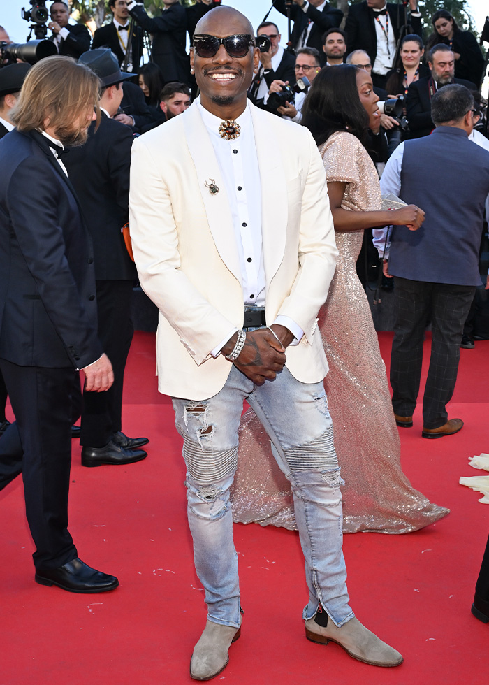 Man in white blazer and ripped jeans at Cannes 2026 fashion fails red carpet
