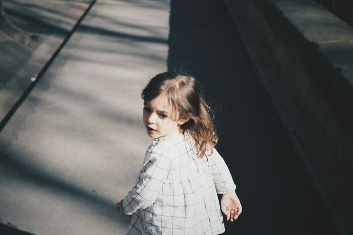 Little girl walking outside illustrating evil MILs stories