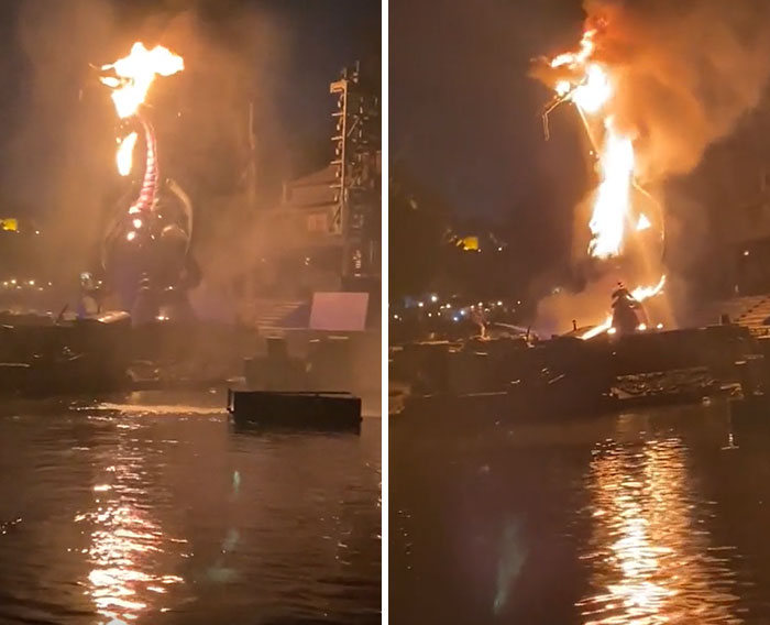 A dragon animatronic on fire, a machinery failure, with flames engulfing its head, reflecting in the water below.