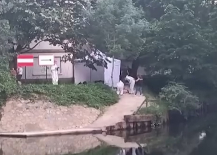 Forensic team investigating a crime scene by a river in France