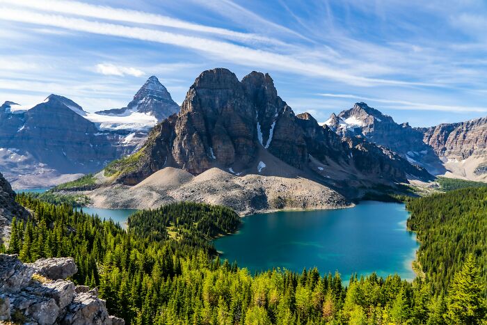Mountain peaks and turquoise lake in a scenic geographic nature view