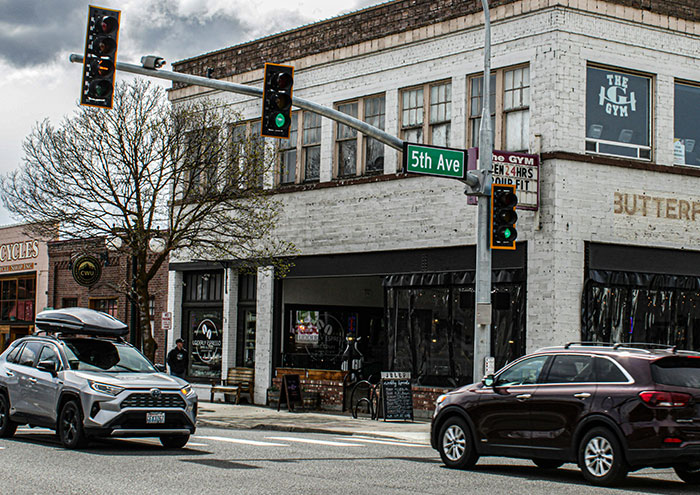 Street view at traffic light intersection representing ordinary moments near passing away