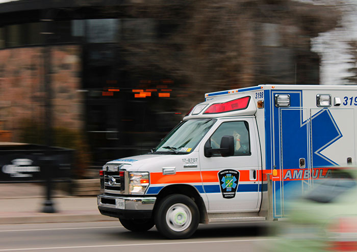 Ambulance rushing on street during emergency related to passing away