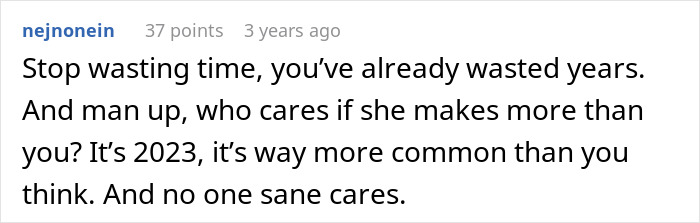 A Reddit comment advises a man who regrets leaving his wife and kids to "man up" about his wife earning more.