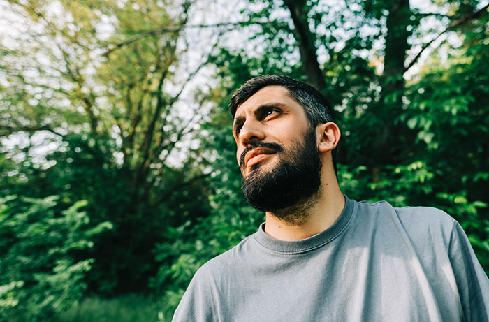 Man outdoors looking uneasy about creepy things women did