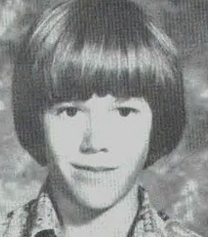 Black and white photo of a young boy with bowl haircut relating to Wikipedia dark rabbit holes